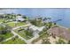 Aerial view of waterfront homes featuring private docks and well-manicured lawns on a sunny day at 4460 Northshore Dr, Punta Gorda, FL 33980