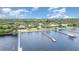Waterfront homes featuring private docks on a sunny day, with lush green trees lining the community at 4460 Northshore Dr, Punta Gorda, FL 33980