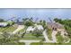 Aerial view of waterfront homes with private docks, showcasing well-maintained lawns and mature trees at 4460 Northshore Dr, Punta Gorda, FL 33980
