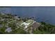 A beautiful waterfront home with a white metal roof, a serene pool, and a private dock providing access to waterfront living at 4460 Northshore Dr, Punta Gorda, FL 33980