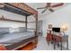 Bedroom with decorative dark-wood canopy bed frame, desk, and white walls creating an elegant decorative style at 4460 Northshore Dr, Punta Gorda, FL 33980