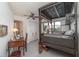 Bedroom with dark-wood, canopy bed frame, desk, and white closet doors, enhancing its unique decorative charm at 4460 Northshore Dr, Punta Gorda, FL 33980