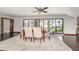 Elegant dining room featuring modern furnishings and bright natural light, seamlessly connecting indoor and outdoor spaces at 4460 Northshore Dr, Punta Gorda, FL 33980