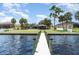Scenic view of a private dock extending into the sparkling waters at 4460 Northshore Dr, Punta Gorda, FL 33980