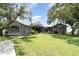 Beautifully landscaped front yard of a single-story home with a charming entrance at 4460 Northshore Dr, Punta Gorda, FL 33980
