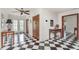 Foyer showcasing black-and-white checkered flooring and decorative tables and furniture for a classic aesthetic at 4460 Northshore Dr, Punta Gorda, FL 33980