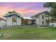Beautiful two-story home with a well-manicured lawn and stone facade, perfect for curb appeal at 4460 Northshore Dr, Punta Gorda, FL 33980