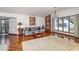 Bright living room with hardwood floors, large windows with pool view, and an elegant chandelier at 4460 Northshore Dr, Punta Gorda, FL 33980