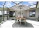 An inviting outdoor living space with a striped umbrella over a table and chairs at 4460 Northshore Dr, Punta Gorda, FL 33980