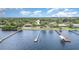 Waterfront property featuring a private dock, well-maintained lawn, and outdoor pool for premier waterfront living at 4460 Northshore Dr, Punta Gorda, FL 33980