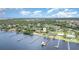 Picturesque view of waterfront homes, including private docks and a lush green landscape showcasing the beauty of waterfront living at 4460 Northshore Dr, Punta Gorda, FL 33980