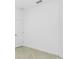 A bright, empty bedroom featuring neutral flooring, white trim, and white walls at 8706 Seasalt Loop, Englewood, FL 34224