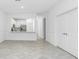 Modern living room featuring tiled floors, open-concept design, and double door closet at 8706 Seasalt Loop, Englewood, FL 34224
