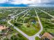 Beautiful Cape Coral property featuring a pool, shed, and fully fenced yard surrounded by lush greenery in a quiet community at 9954 Audrey St, Port Charlotte, FL 33981