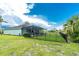 Enjoy the Florida lifestyle with a screened lanai and fenced backyard perfect for outdoor entertaining and relaxation at 9954 Audrey St, Port Charlotte, FL 33981