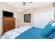 Bedroom featuring a TV on a bureau with a painting on the wall at 9954 Audrey St, Port Charlotte, FL 33981