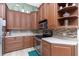 This kitchen has custom wood cabinets, stainless steel appliances, and a tile backsplash at 9954 Audrey St, Port Charlotte, FL 33981