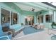 Comfortable lanai with stylish seating, ceiling fan, and views of the pool at 9954 Audrey St, Port Charlotte, FL 33981