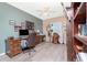 A home office with a desk, chair, shuttered window and ceiling fan at 9954 Audrey St, Port Charlotte, FL 33981
