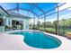 Inviting screened pool with a spacious deck and views of the backyard at 9954 Audrey St, Port Charlotte, FL 33981