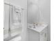 Clean, white bathroom featuring a white vanity with modern fixtures at 11383 Burgundy Dr, Venice, FL 34293