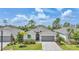 Charming single-Gathering home featuring a paver driveway, manicured landscaping, and a neutral color palette at 11383 Burgundy Dr, Venice, FL 34293