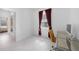 Bright office features tile flooring, a desk with silver drawer and an yellow office chair at 11383 Burgundy Dr, Venice, FL 34293