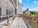 A screened balcony offers outdoor relaxation with a view of the community and landscaping at 1144 Bird Bay Way # 102, Venice, FL 34285
