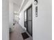 Condo hallway with a black door and the number 1144 and a black welcome mat at 1144 Bird Bay Way # 102, Venice, FL 34285