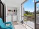 This enclosed lanai offers a washer/dryer, grill, and space to relax while enjoying a view at 1144 Bird Bay Way # 102, Venice, FL 34285