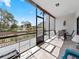This lanai has a peaceful view of a pond and fountain, accessible through sliding glass doors at 1144 Bird Bay Way # 102, Venice, FL 34285