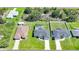 Aerial view of a residential neighborhood showcasing neatly landscaped yards and a private pool at 12112 Helios Ave, Port Charlotte, FL 33981