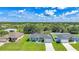 Sprawling single Gathering home with a two car garage surrounded by lush trees and ample land at 12112 Helios Ave, Port Charlotte, FL 33981