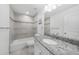 Elegant bathroom with granite countertops and tiled shower/tub combo at 12112 Helios Ave, Port Charlotte, FL 33981