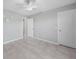 Bright bedroom features tile floors and a ceiling fan, offering a cool and stylish space at 12112 Helios Ave, Port Charlotte, FL 33981