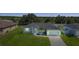 Attractive single-level house with a two-car garage, fresh landscaping, and inviting curb appeal at 12112 Helios Ave, Port Charlotte, FL 33981
