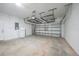 Spacious garage with ample storage and overhead racks, offering organization and convenience at 12112 Helios Ave, Port Charlotte, FL 33981
