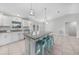 Stylish kitchen featuring a spacious island, granite countertops, stainless steel appliances, and modern lighting at 12112 Helios Ave, Port Charlotte, FL 33981