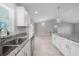 Bright and airy kitchen with granite countertops, stainless steel appliances, and a large island with pendant lighting at 12112 Helios Ave, Port Charlotte, FL 33981