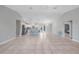 Large living space features tile flooring and an open layout connecting to the kitchen and dining area at 12112 Helios Ave, Port Charlotte, FL 33981
