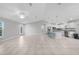 Inviting living room features tile flooring and lots of space, flowing into the kitchen and dining areas at 12112 Helios Ave, Port Charlotte, FL 33981