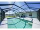 Gorgeous screened-in pool with a step-in entrance and covered outdoor area for relaxation at 12112 Helios Ave, Port Charlotte, FL 33981