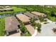 An aerial view of the neighborhood with palm trees surrounding many houses at 13935 Campoleone St, Venice, FL 34293