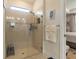 Beautiful bathroom featuring a tiled shower with glass door, creating a bright, modern space at 13935 Campoleone St, Venice, FL 34293