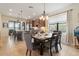 Dining area adjacent to the kitchen featuring a chandelier and a view of the lanai at 13935 Campoleone St, Venice, FL 34293