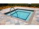 Close up of the hot tub with clear blue water and steel railing at the IslandWalk community at 13935 Campoleone St, Venice, FL 34293