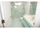 Bathroom features a shower over tub, vanity, and toilet at 15037 Mcgraw Ave, Port Charlotte, FL 33953