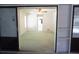 This bedroom provides access to the screened lanai area through a sliding glass door at 15037 Mcgraw Ave, Port Charlotte, FL 33953