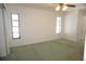 Bright bedroom with two windows and a ceiling fan at 15037 Mcgraw Ave, Port Charlotte, FL 33953