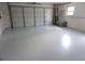 Spacious two car garage with epoxy flooring and insulated garage door at 15037 Mcgraw Ave, Port Charlotte, FL 33953